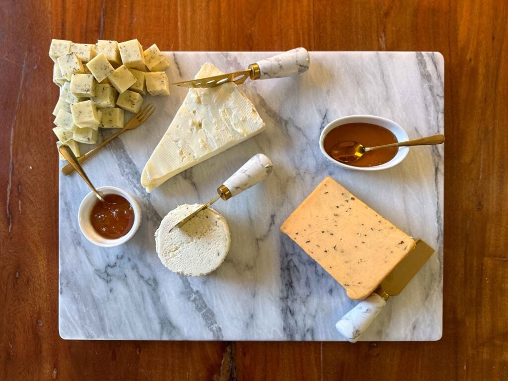 Charcuterie board with cheeses and dips