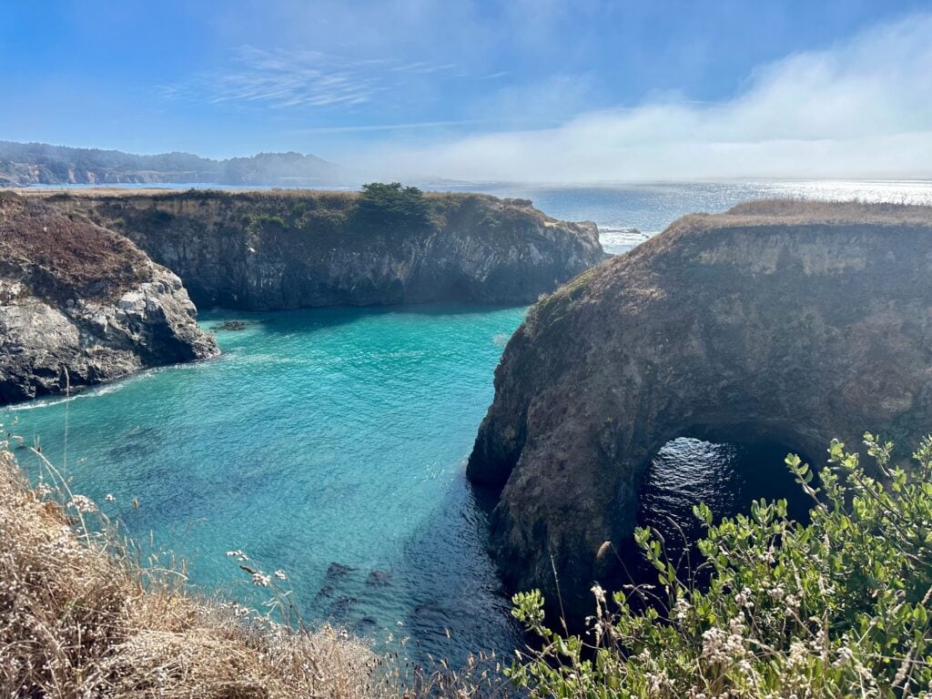 Turquoise cove framed by cliffs along Mendocino’s dramatic coastline