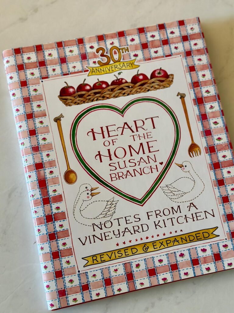 Vintage-style cookbook with hand-drawn art and hearts — a charming kitchen staple for sentimental Enneagram 6s.