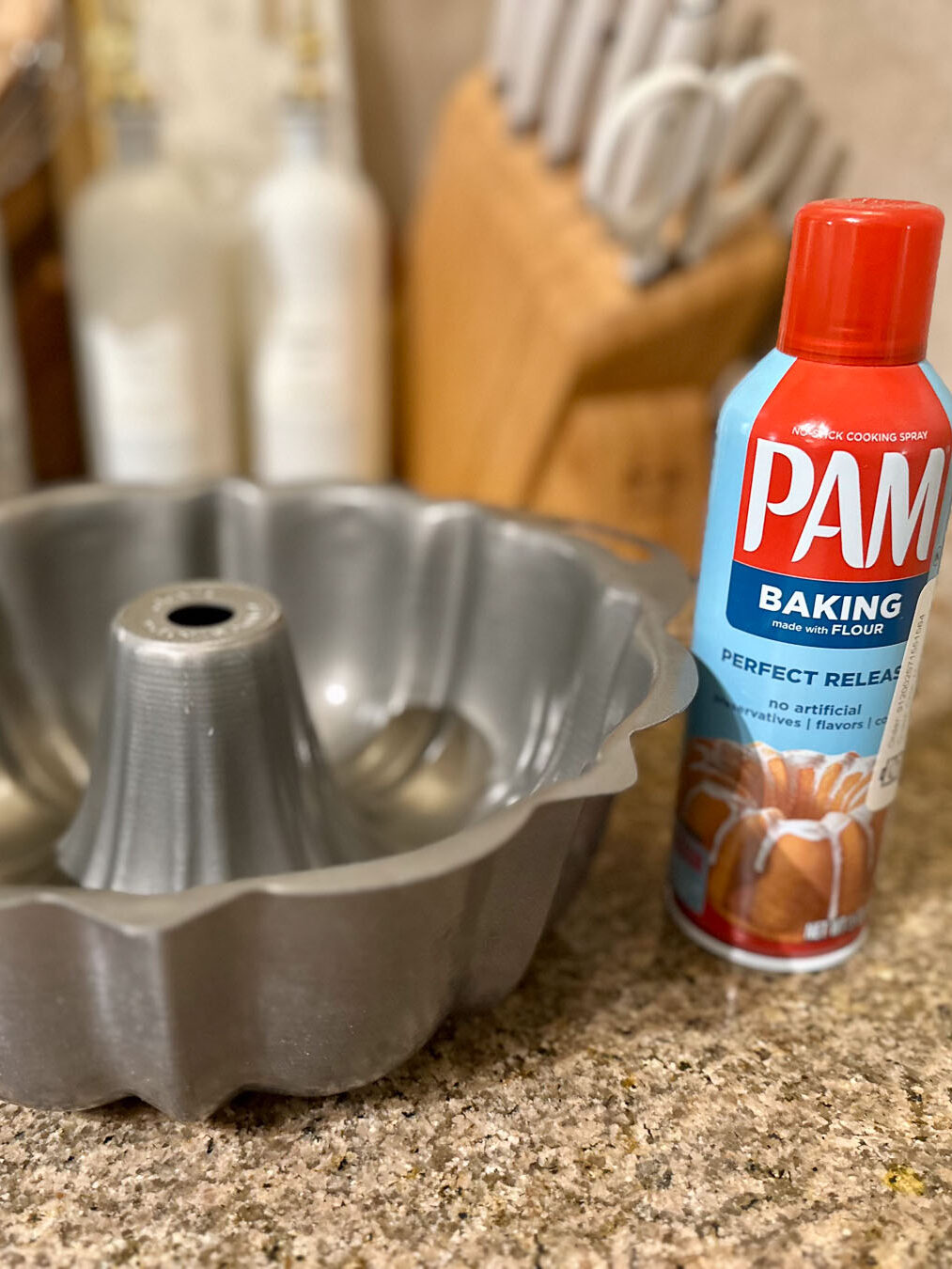 Bundt pan with PAM baking spray can beside it.