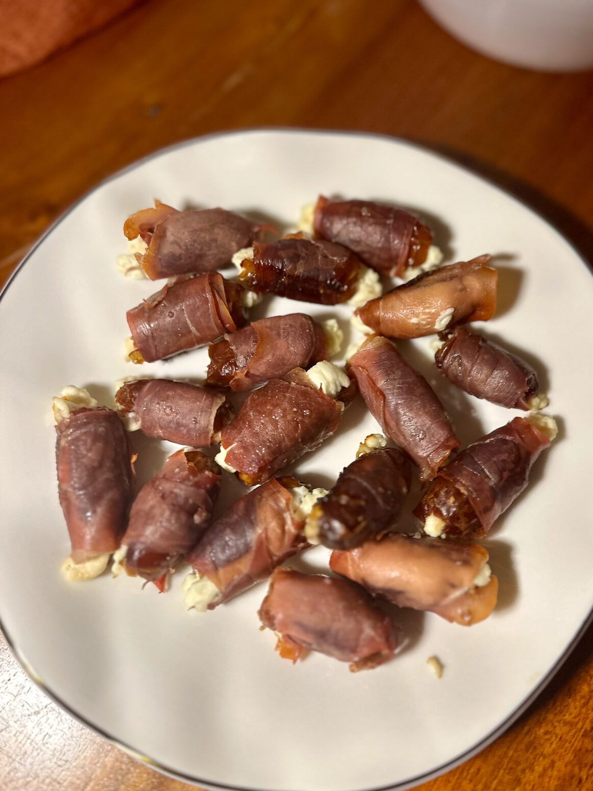 Goat cheese–stuffed dates wrapped in prosciutto.