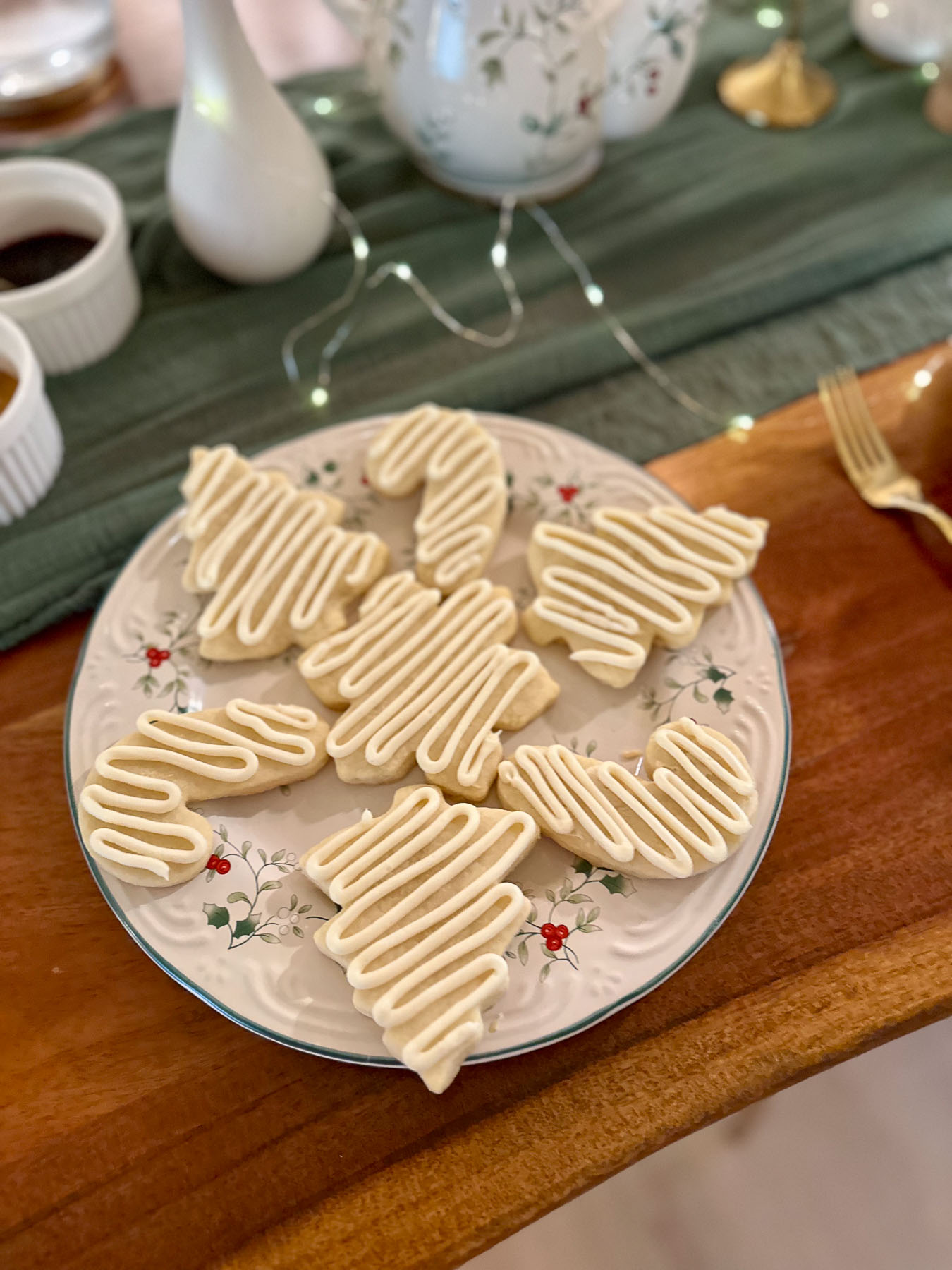 Christmas tree sugar cookies with white icing served as sweets at a Christmas tea party