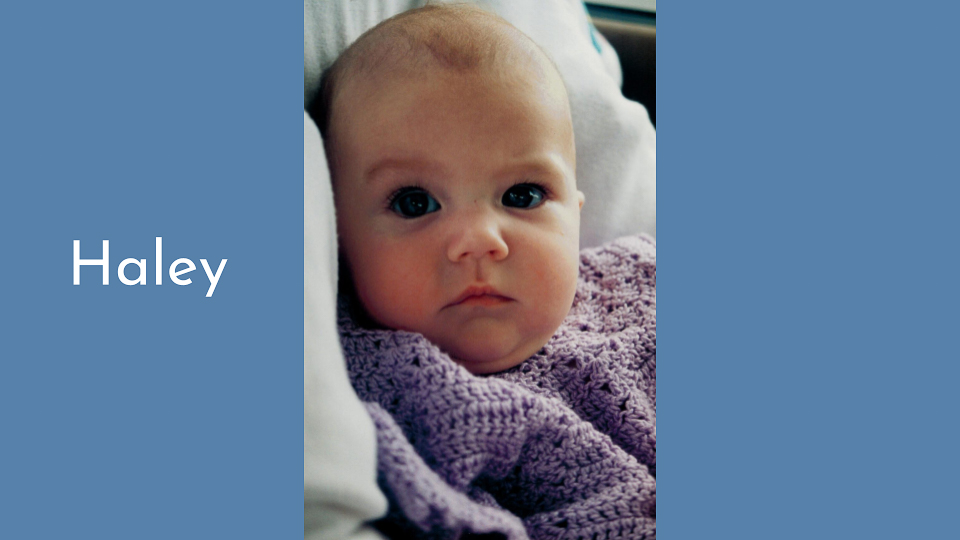 Baby shower game reveal slide with baby photo and correct answer displayed