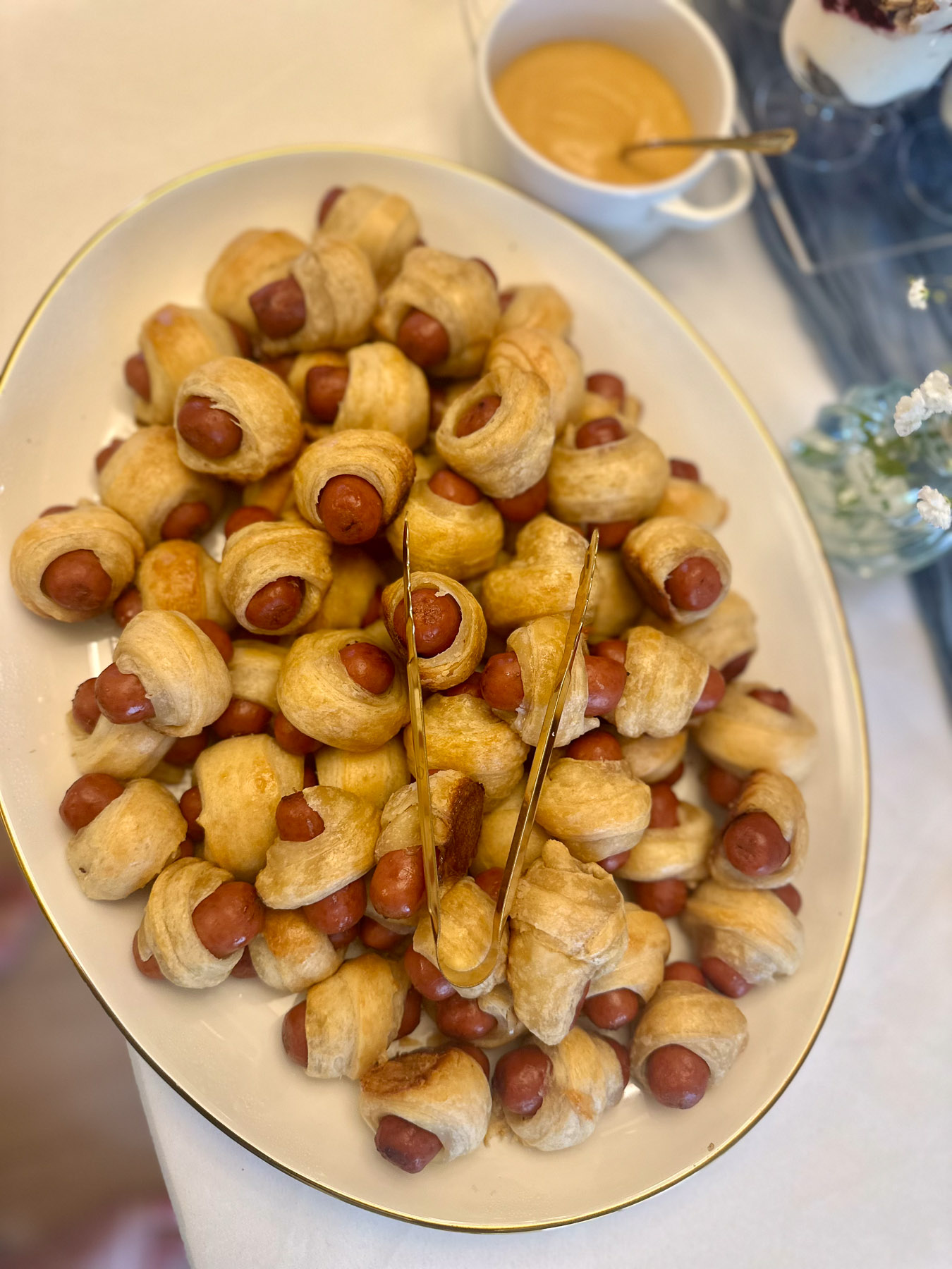 Pigs in a blanket appetizers served on a platter for a baby shower