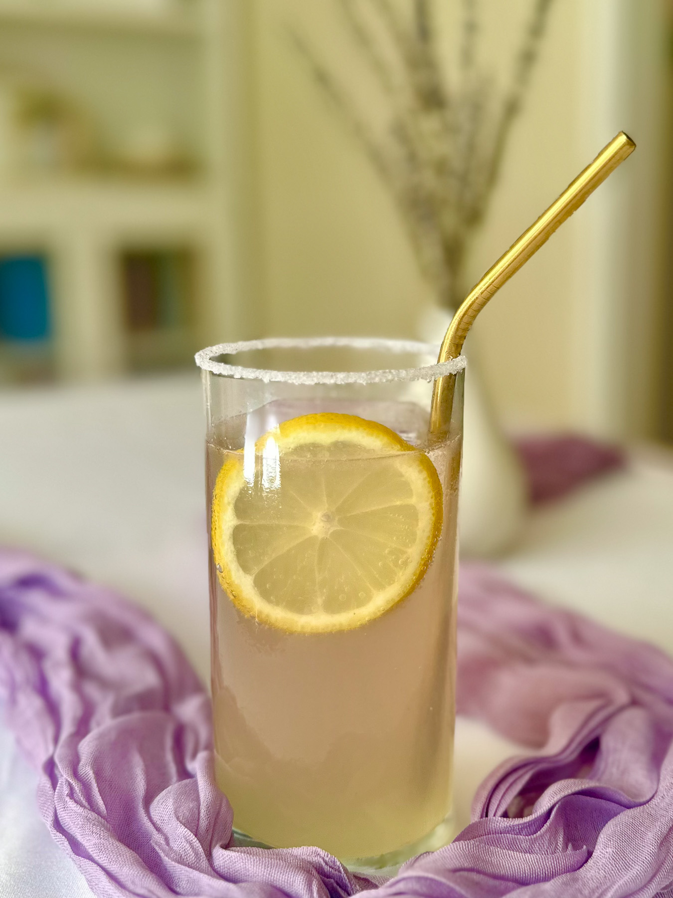 Lavender mocktail with lemon and elderflower served over ice with a lemon slice